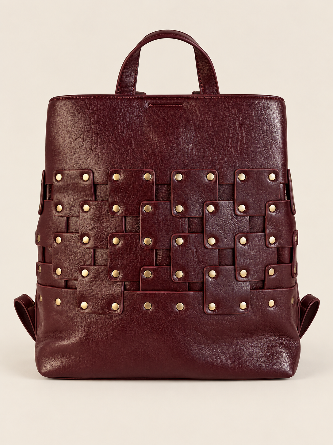 MOCHILA TRENZADA TACHUELAS